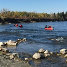 Students row boating at Red Deer River