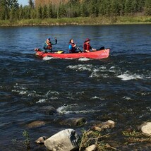 Students row boating at Red Deer River