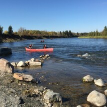 Students row boating at Red Deer River